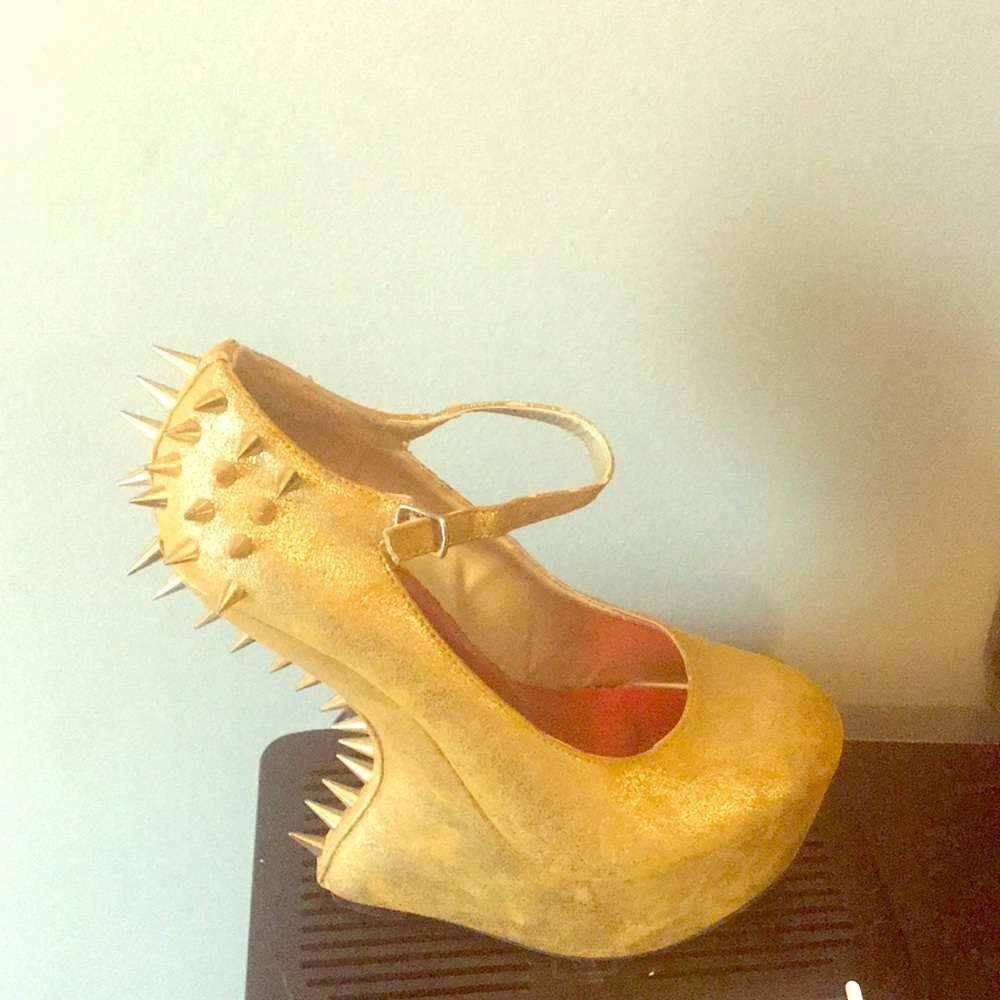 Gold spiked heels